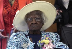 Talley sits at the head table during a celebration of her 115th birthday at the New Jerusalem Missionary Baptist Church in Inkster
