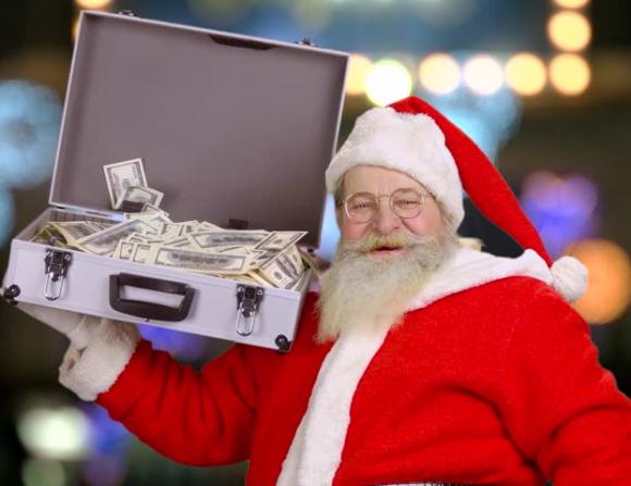 Rapina una banca e lancia i soldi ai passanti urlando: “Buon Natale!”