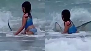 Bimba fugge da uno squalo: la scena ripresa con un cellulare
