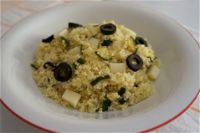 Couscous con zucchine, olive e Asiago
