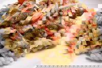 Fusilli con crema di melanzane, speck e pomodori secchi