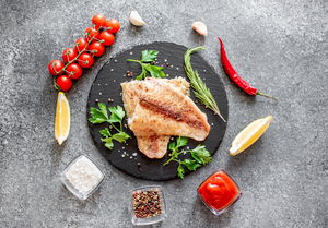 Baked,White,Fish,Fillet,Pangasius,With,Spices,And,Lemon,On