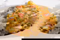 Mezzi rigatoni con crema di zucchine, Philadelphia e prosciutto cotto