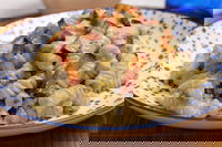 Fusilli con crema di melanzane, ricotta e pancetta