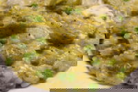 Risotto con crema di zucchine, piselli e gorgonzola