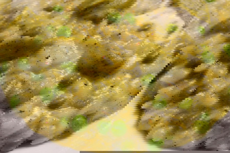 Risotto con crema di zucchine, piselli e gorgonzola