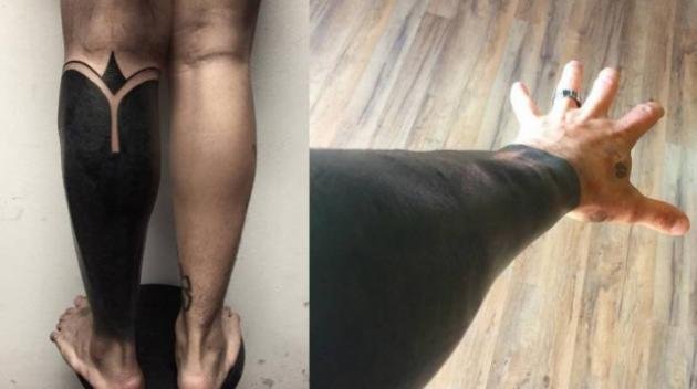 Esempio di blackout tattoo su gamba e braccio