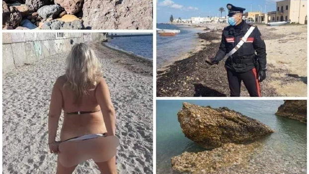 Va in spiaggia e trova la moglie senza slip insieme al cane