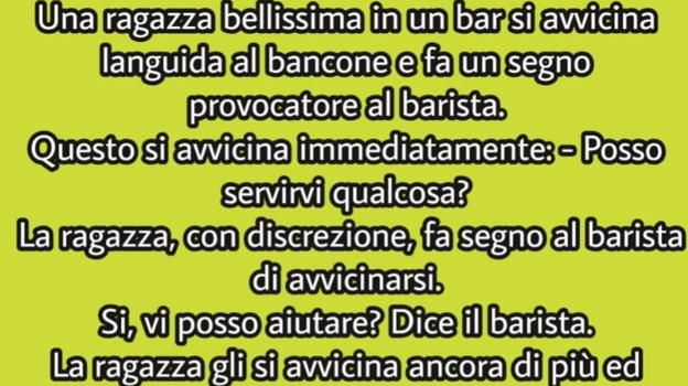 Una ragazza in un bar si avvicina al bancone e fa un segno al barista