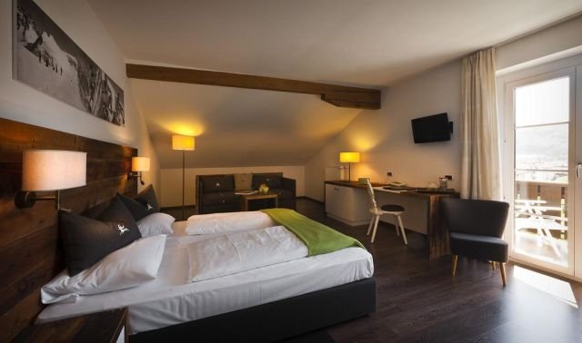 Un'elegante camera dell'Hotel Andreas Hofer di Brunico, albergo a 4 stelle della capitale della Val Pusteria